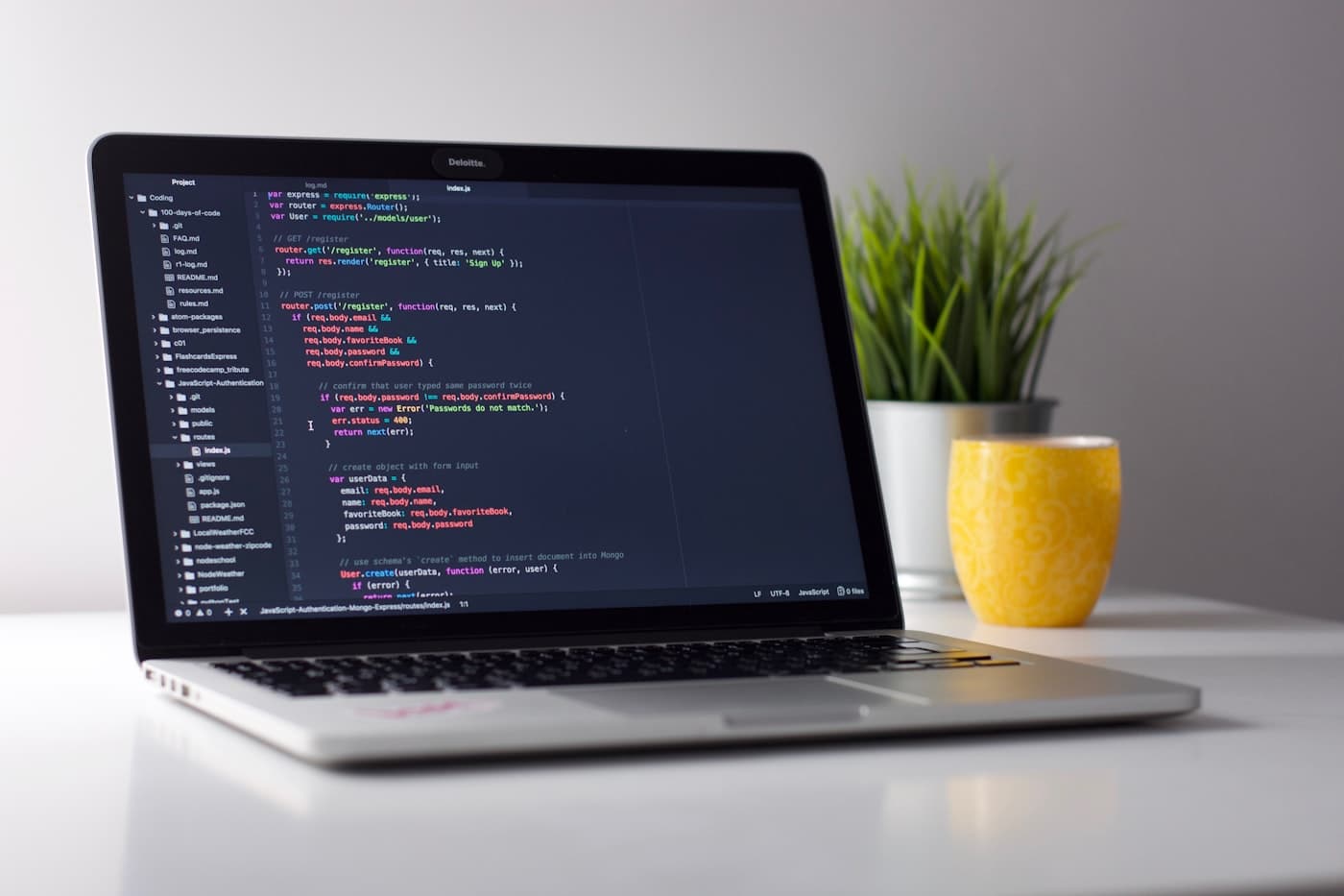 Developer workspace with code editor on a laptop