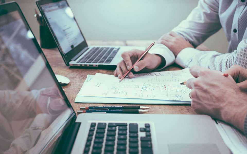 Financial planning work with documents and laptop